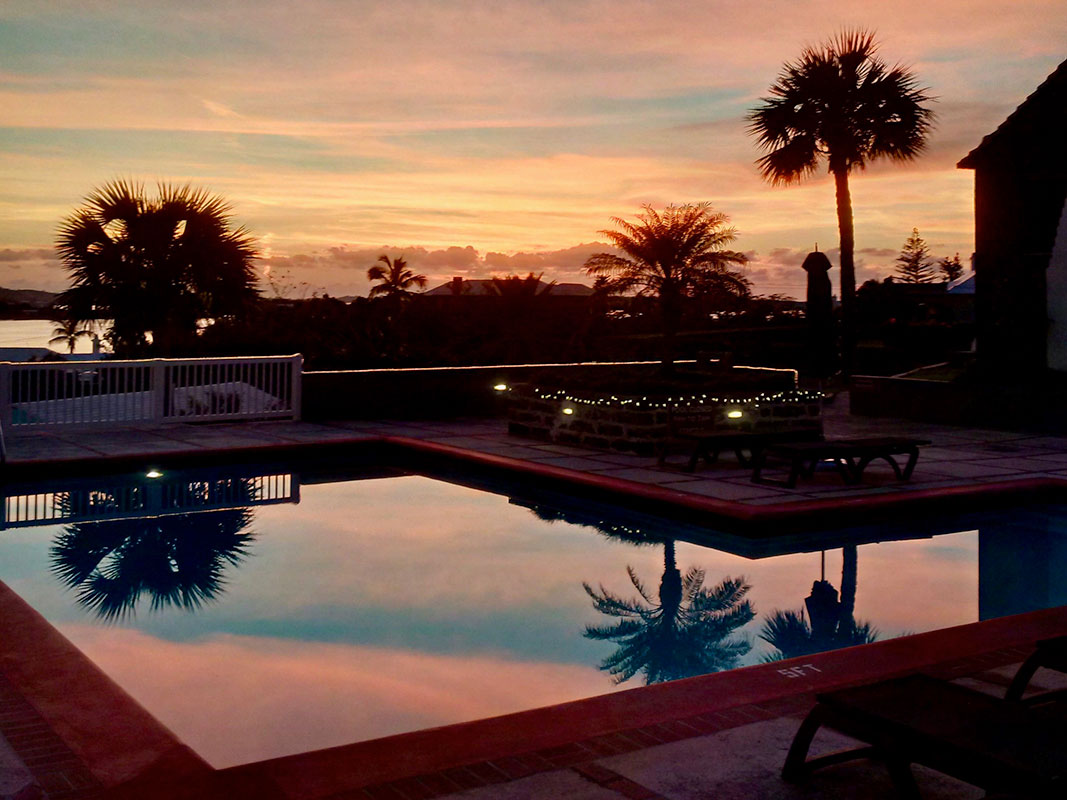 Outdoor pool at sunset